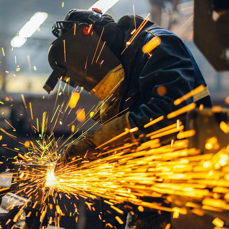worker using an angle grinder