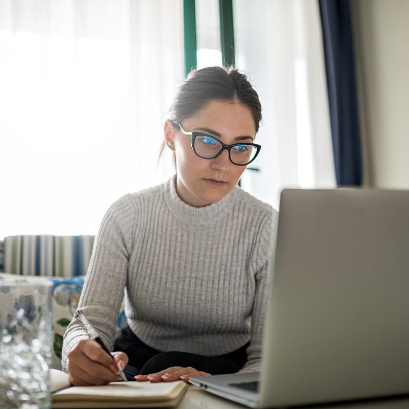 Young Woman Doing Finances at Home