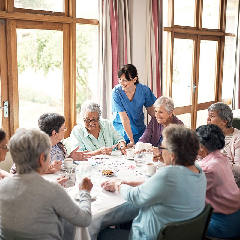 Shot of a Group of Senior Women Playing Cards Together at a Retirement Home