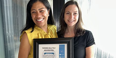 Business owner Jacqueline Campbell receiving her NAWBO membership certificate from Jennifer Cortese, a Business Banker at Byline Bank.