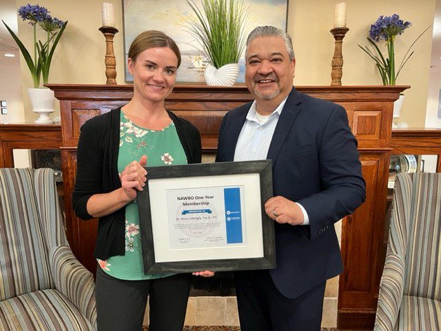 Robert Baitler (right), Vice President, Business Banking, presents Dr. Anna Zabiegly with her NAWBO membership certificate.