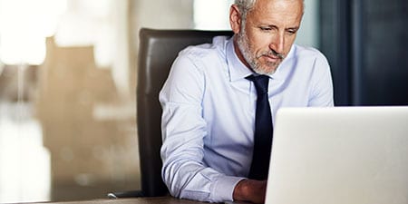businessman looking at his online accounts